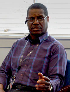 Veteran and VA Counselor Steven Nettles in mid conversation, discussing how he enjoys helping Veterans.